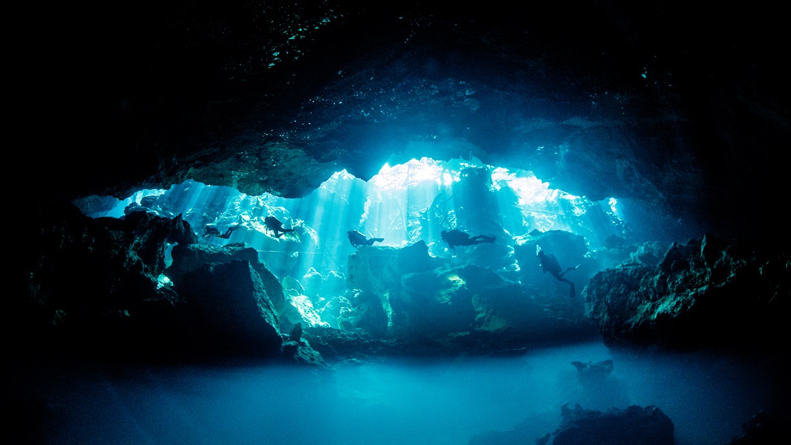 Cenote Chac Mool with its stunning curtain of lights, during cenote diving