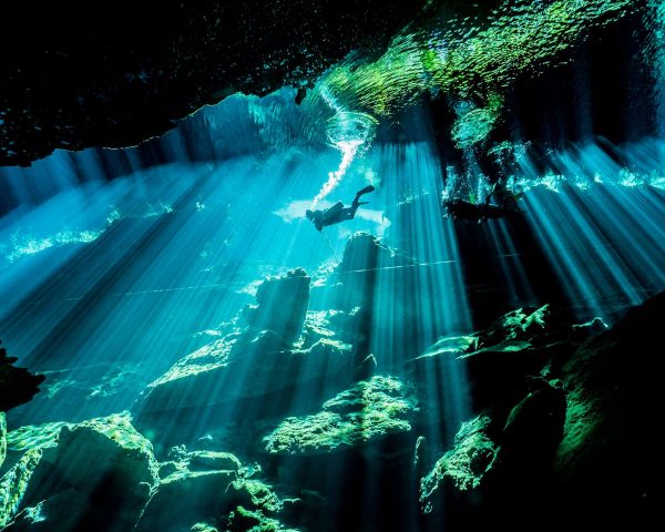 Breathtaking curtain of lights in Cenote Chac Mool